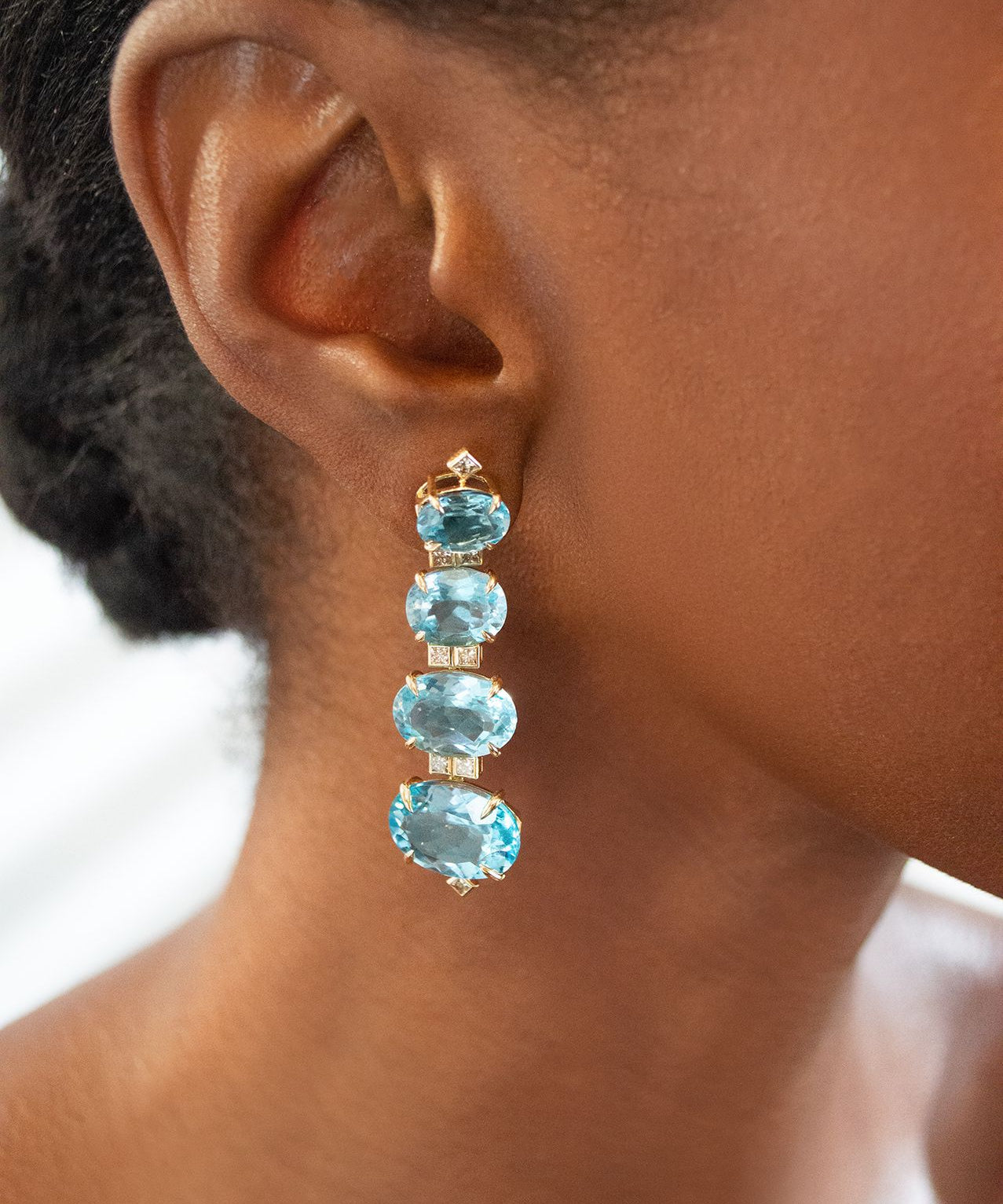 52.858ct Sky Blue Topaz Brown Diamond 18K Earrings