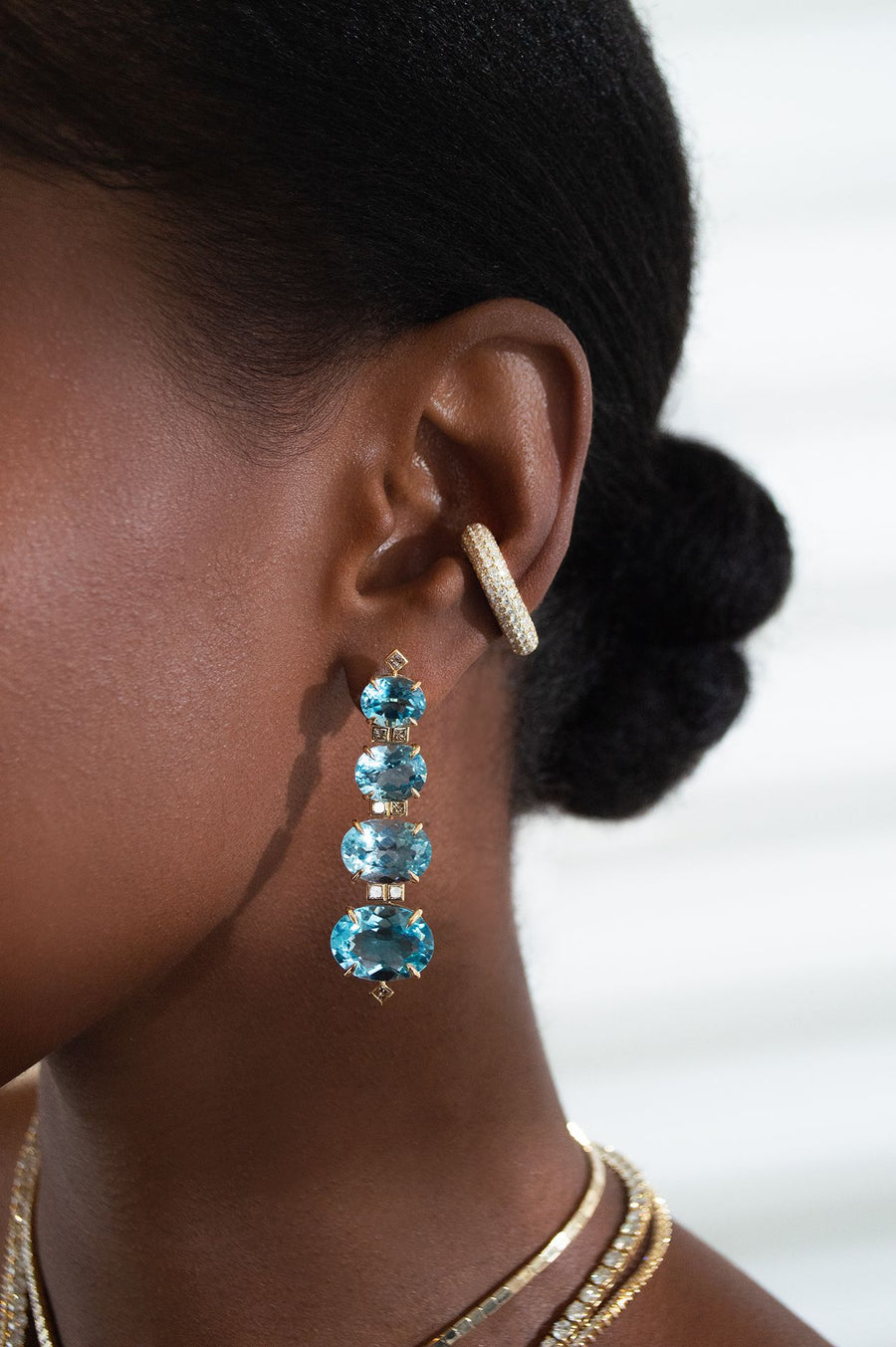 52.858ct Sky Blue Topaz Brown Diamond 18K Earrings